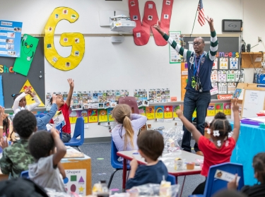 Teacher Jonathan Clausell conducts a math lesson as his students finish eating in his pre-K class at C.A. Weis Elementary Community Partnership School in Pensacola, Florida, Friday, March 5, 2021, photo by Gregg Pachkowski for USA Today via Reuters