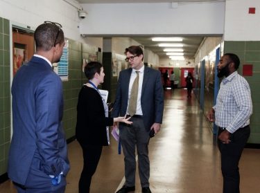 Educators talking in a school hallway, photo by Claire Holt/The Wallace Foundation