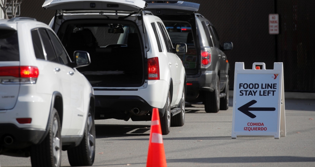 Cars line up during a food drive in East Rutherford, New Jersey, November 24, 2020