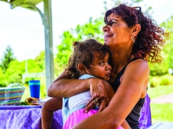 Australian Aboriginal woman giving her granddaughter a hug in the parkAustralian Aboriginal woman giving her granddaughter a hug in the park, photo by davidf/iStock by Getty Imageshoto by davidf/iStock by Getty Images