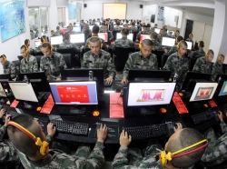 Chinese soldiers using desktop computers at a garrison of the PLA in Chongqing, China, November 14, 2013, photo by Gao Xiaowen/Reuters
