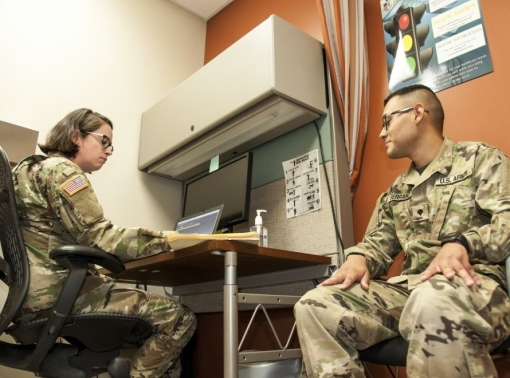 A nurse practitioner asks health-related questions during a session on a U.S. Army Base