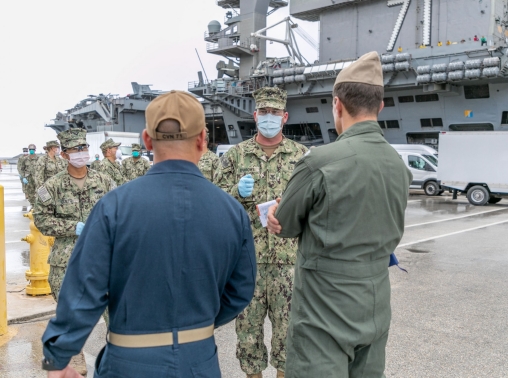 Seabees coordinate transportation of USS Theodore Roosevelt sailors who tested negative for COVID-19 from Naval Base Guam to military-approved commercial lodging, in Guam, April 3, 2020