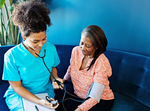 A nurse taking a patient's blood pressure