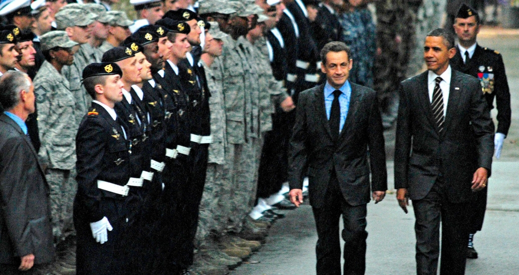 Presidents Barack Obama and Nicolas Sarkozy at a ceremony honoring service members who supported the international response to the unrest in Libya, at Cannes City Hall, November 4, 2011