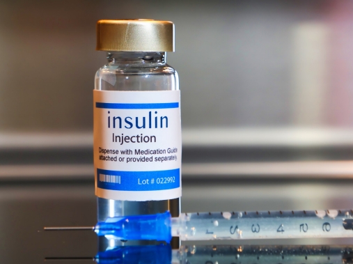 Vial of insulin with a syringe