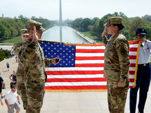 Sgt. Audrey L. Santana (right) re-enlists April 21 on the steps of the Lincoln Memorial. Administering the oath of enlistment is Col. Bernard Koelsch, deputy director of Defense Media Activity, photo by U.S. Army