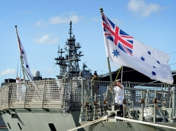Australian sailors raise the colors aboard HMAS Darwin, photo by Royal Australian Navy photo by Cpl. Chris Dickson/Royal Australian Navy