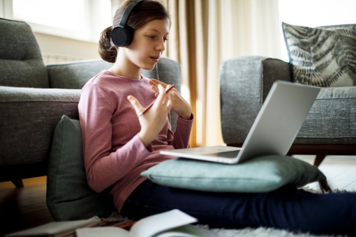 A student using her laptop at home