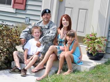 An Army family poses for a photograph