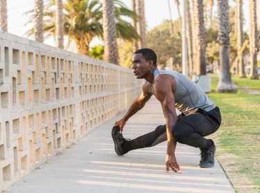 African American man stretching in the park in Los Angeles, California