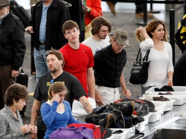 Travelers line up at Denver International Airport