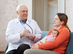 pediatrician with patient and mother