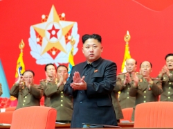 North Korean leader Kim Jong Un applauds during a meeting of security personnel of the Korean People's Army