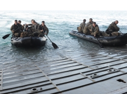 Expeditionary Unit (MEU) depart the well deck of the amphibious assault ship, USS Makin Island, in a combat rubber raiding craft during Tiger Strike 2016