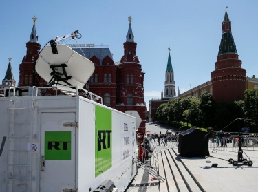 Vehicles of Russian state-controlled broadcaster Russia Today are seen near Red Square in Moscow, Russia, June 15, 2018