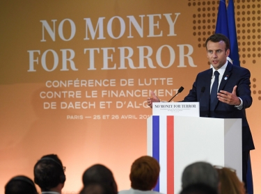 French President Emmanuel Macron gives a speech at an international conference to discuss ways of cutting funding to terrorist groups, at the OECD headquarters in Paris, France, April 26, 2018