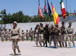 A U.S. soldier marches, followed by troops from various NATO countries, during a ceremony of the transfer of command in Herat, Afghanistan, May 31, 2005, photo by Ahmad Fahim/Reuters
