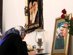 A woman signs a condolence book for Iranian Major-General Qassem Soleimani at the Iranian embassy in Minsk, Belarus, January 10, 2020, photo by Vasily Fedosenko/Reuters