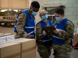 Oklahoma National Guardsmen check medical supply orders for quality while conducting warehouse support operations at the Strategic National Stockpile in Oklahoma City, April 20, 2020, photo by Tech. Sgt. Kasey Phipps/OK Air National Guard