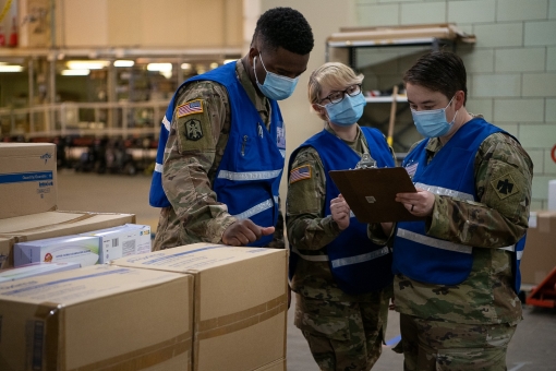 Oklahoma National Guardsmen conduct quality control on medical supply orders at the Strategic National Stockpile in Oklahoma City, April 20, 2020