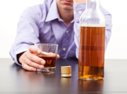 Man drinking whiskey alone
