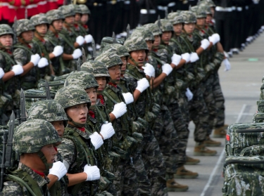 South Korean soldiers conduct a pass in review during a military parade to commemorate the 60th anniversary of the South Korean-U.S. alliance in Seoul, South Korea, October 1, 2013