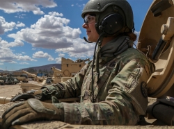 Army 2nd Lt. Caitlyn Simpson prepares her platoon for a training mission from inside a tank at Fort Irwin, Calif., May 28. 2019 . Photo by Army Cpl. Alisha Grezlik/ The U.S. Army / CC BY 2.0