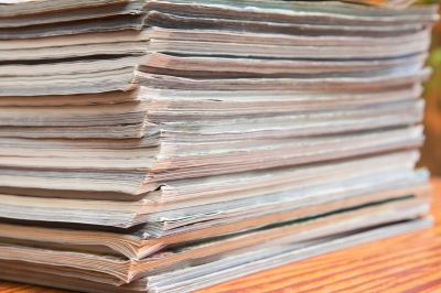 Stack of journals on a wooden desk