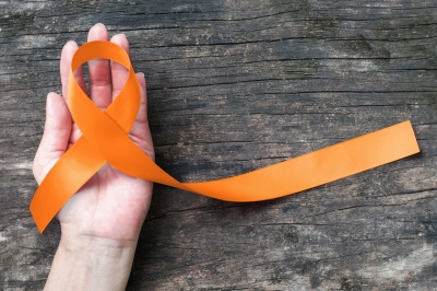 Orange ribbon raising awareness of leukemia, kidney cancer, multiple sclerosis, photo by Chinnapong/Adobe Stock
