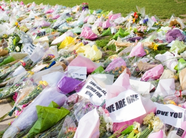 Flowers lying on the grass after a terrorist atack in London