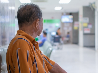 Elderly patient waiting for a doctor in hospital, photo by pongmoji/Adobe Stock
