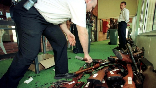 Guns that have just had their barrels crushed in Sydney are stacked after they were handed over on the last day of the Australian gun buyback scheme, September 1997.