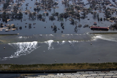 A levee gives way to high water in New Orleans, Louisiana, after Hurricane Katrina struck on August 31, 2005